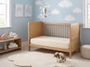 Kids Latex Mattress — in a cot in a sky-and-clouds nursery with a bunny