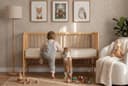 Kids Latex Mattress — fitted in an oak cot in a nursery, with the Sleeping Bunny rabbit
